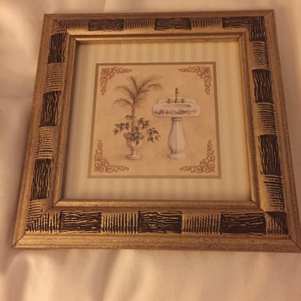 pair of framed bathroom prints